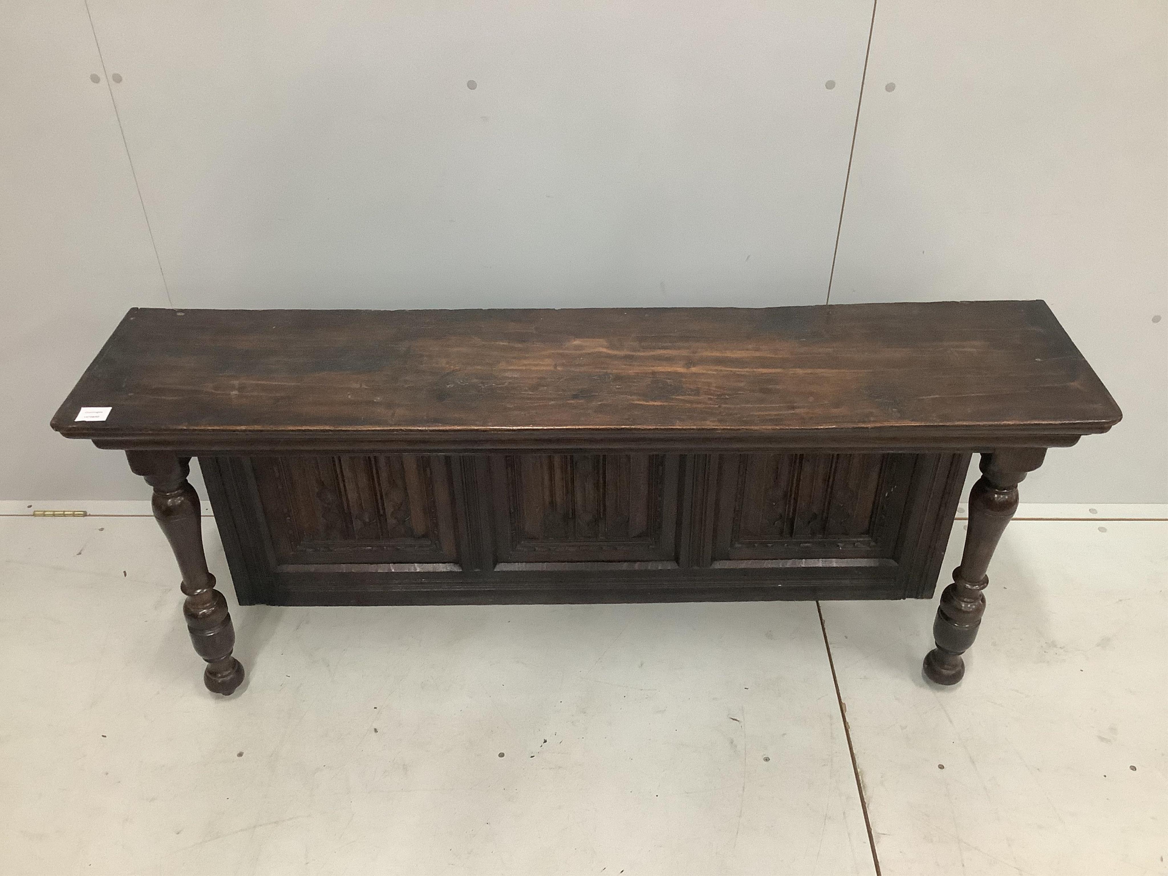 A section of linen fold panelling mounted as a sideboard back, width 165cm, height 65cm. Condition - good